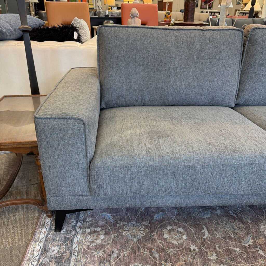 Gray sofa in a furniture store setting