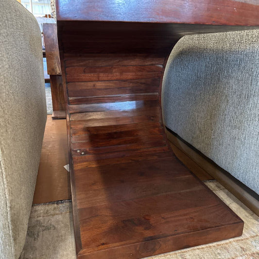 Wooden desk with a chair on a carpeted floor