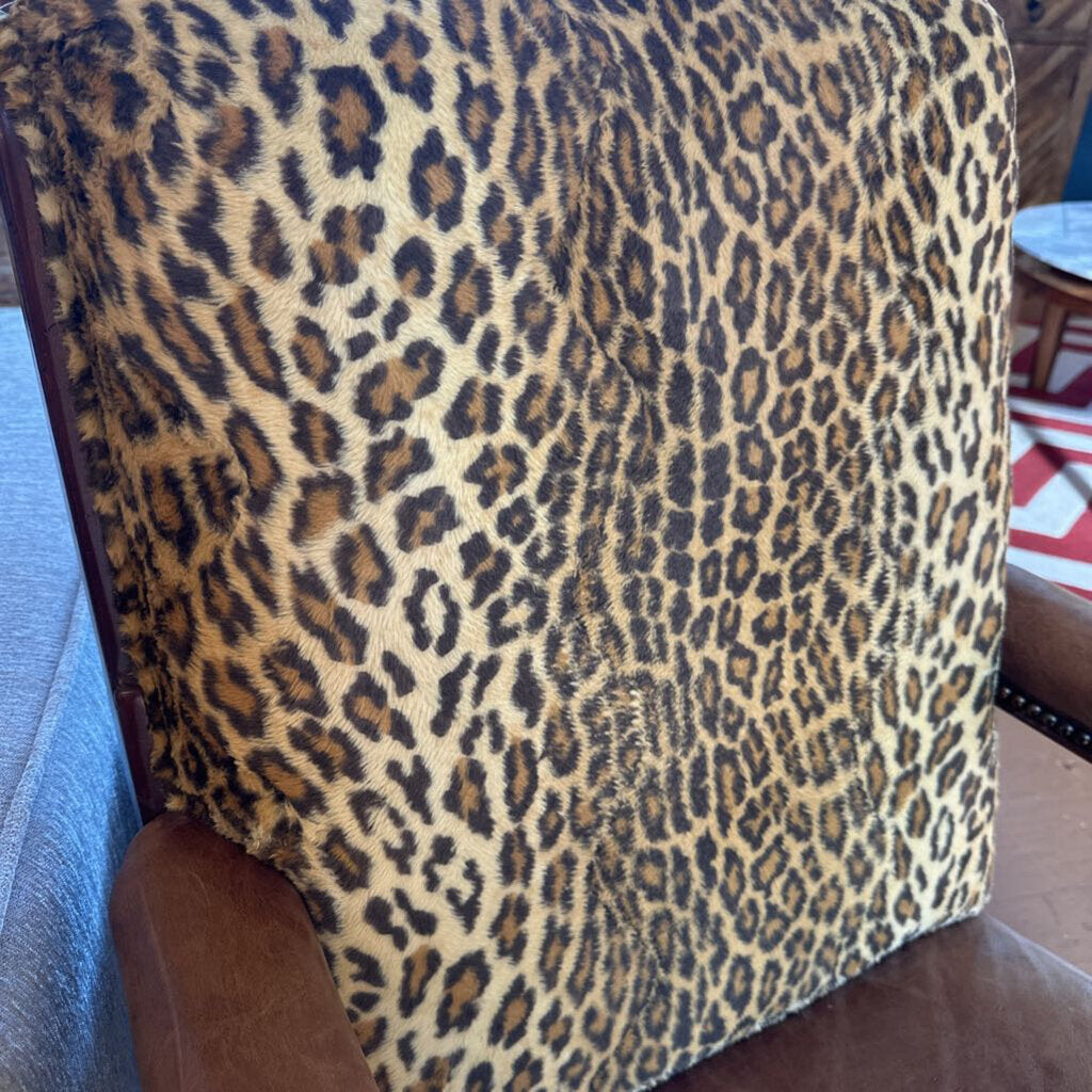 Leopard print blanket draped over a chair