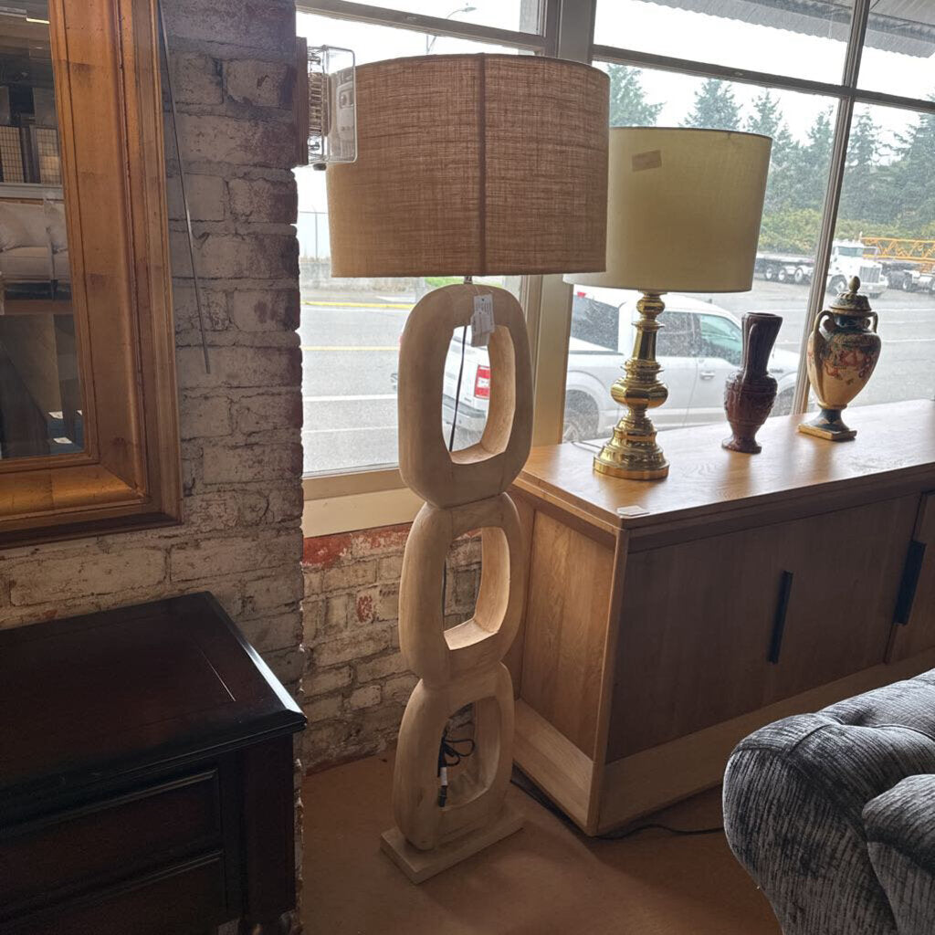 Decorative lamp with a unique design in a room setting.