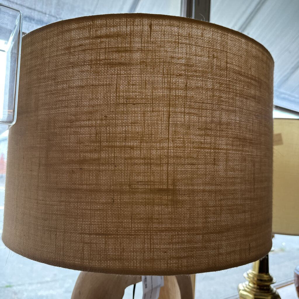 Close-up of a brown textured lampshade with a blurred background