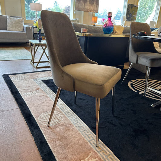 Dining chair in a room with a rug and other furniture