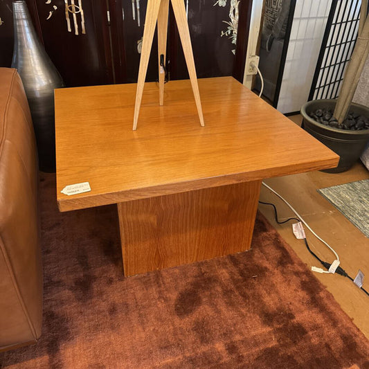 Wooden table with a stand in a room setting