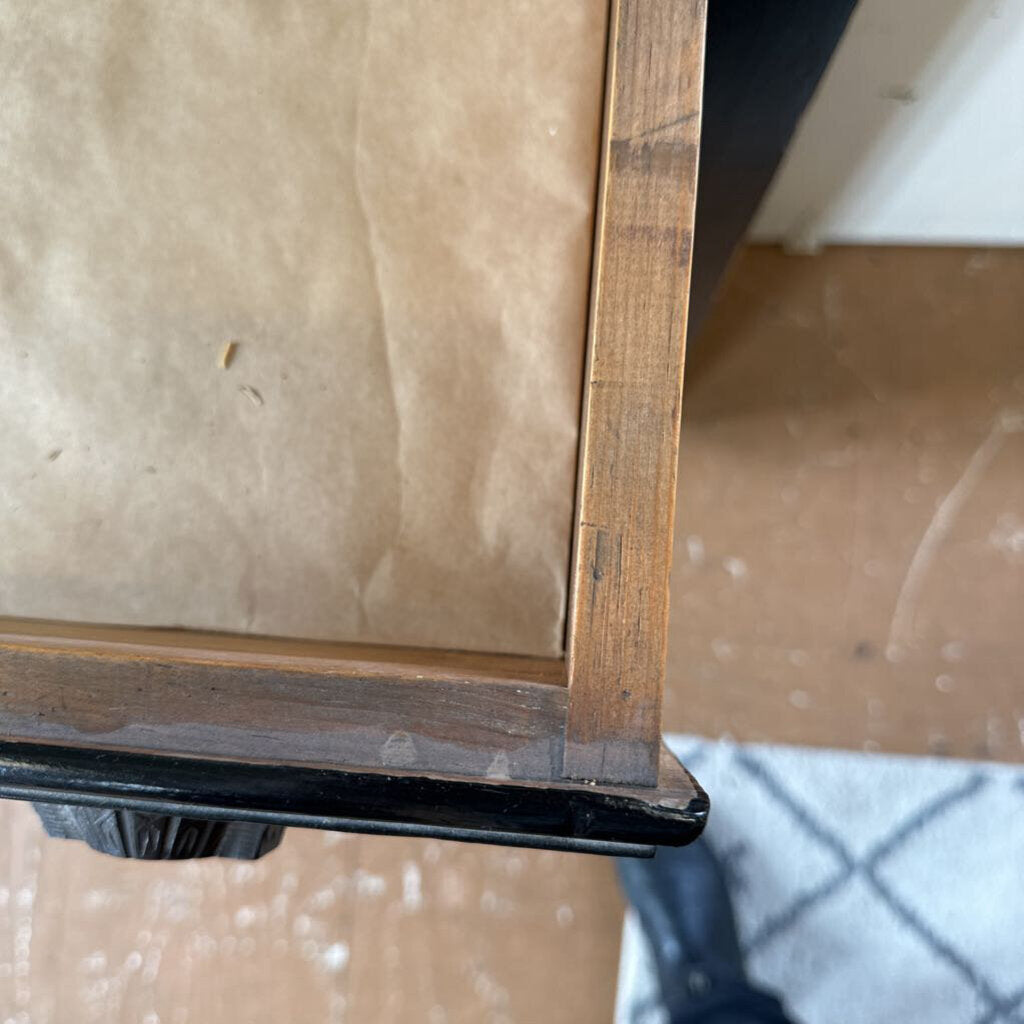 Close-up of a wooden frame with a blurred background
