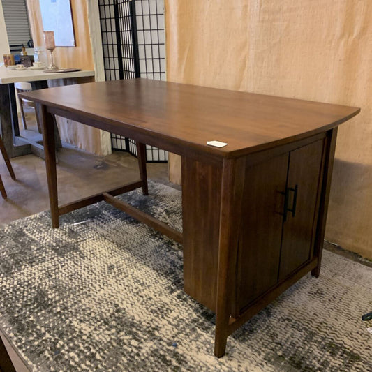 Wooden desk with a cabinet in a room setting