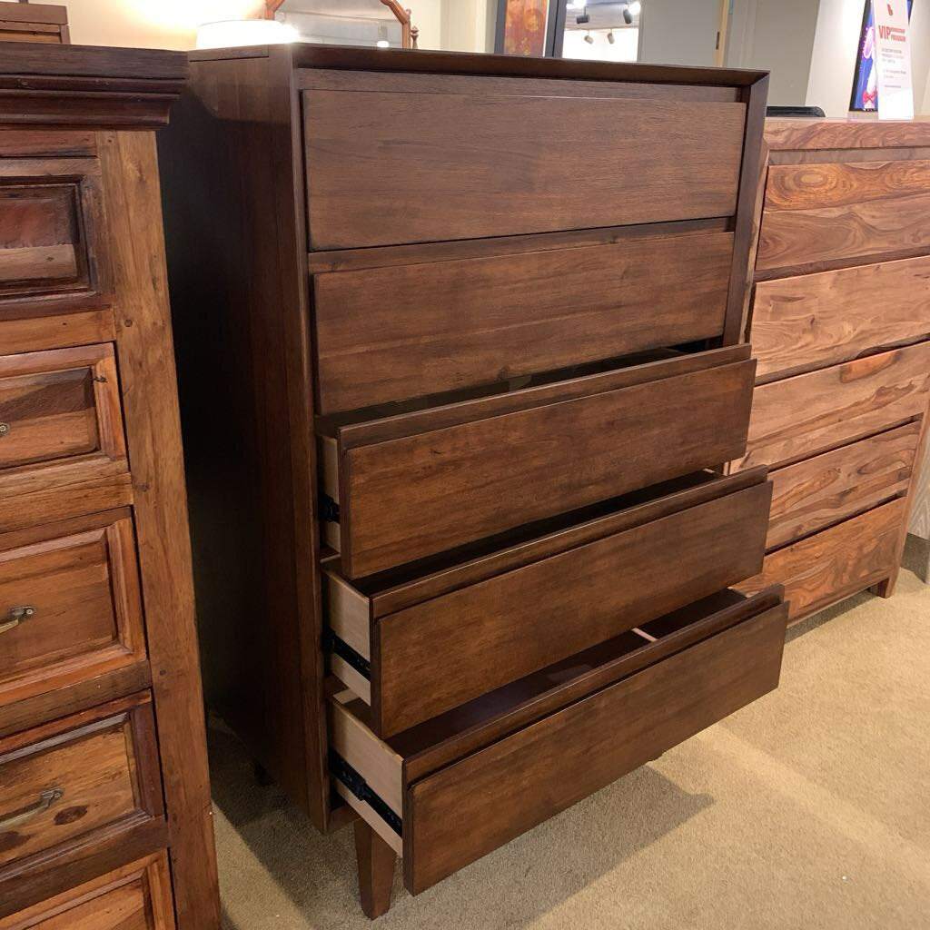 Wooden dresser with multiple drawers in a room setting