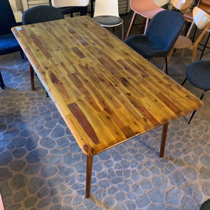 Wooden table with a textured surface in an indoor setting