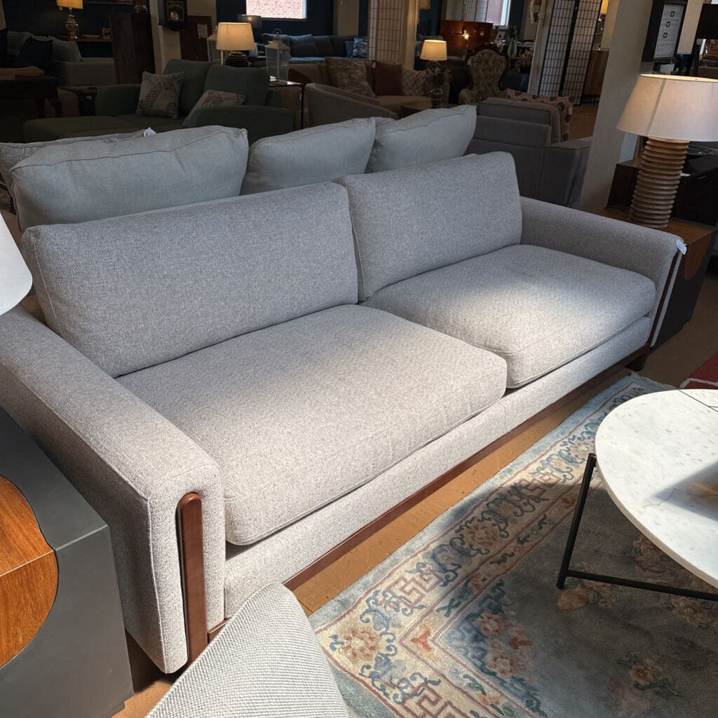 Gray sofa in a room with other furniture and decor