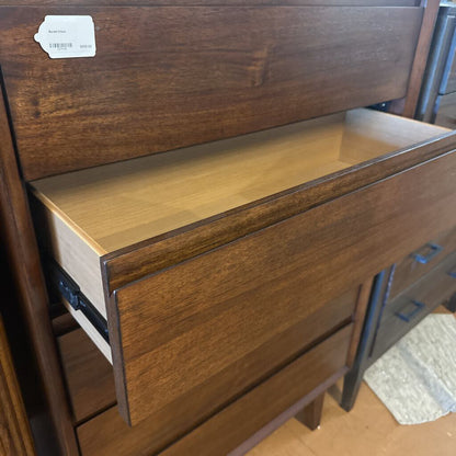 Wooden drawer with a label on a wooden surface