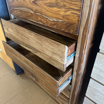 Wooden dresser with open drawers on a tiled floor