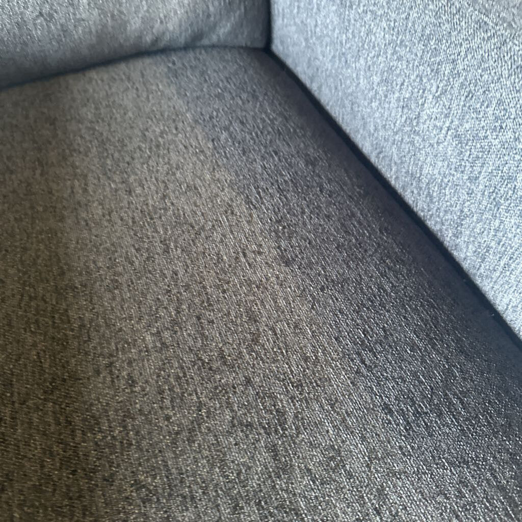 Close-up of a textured gray fabric surface