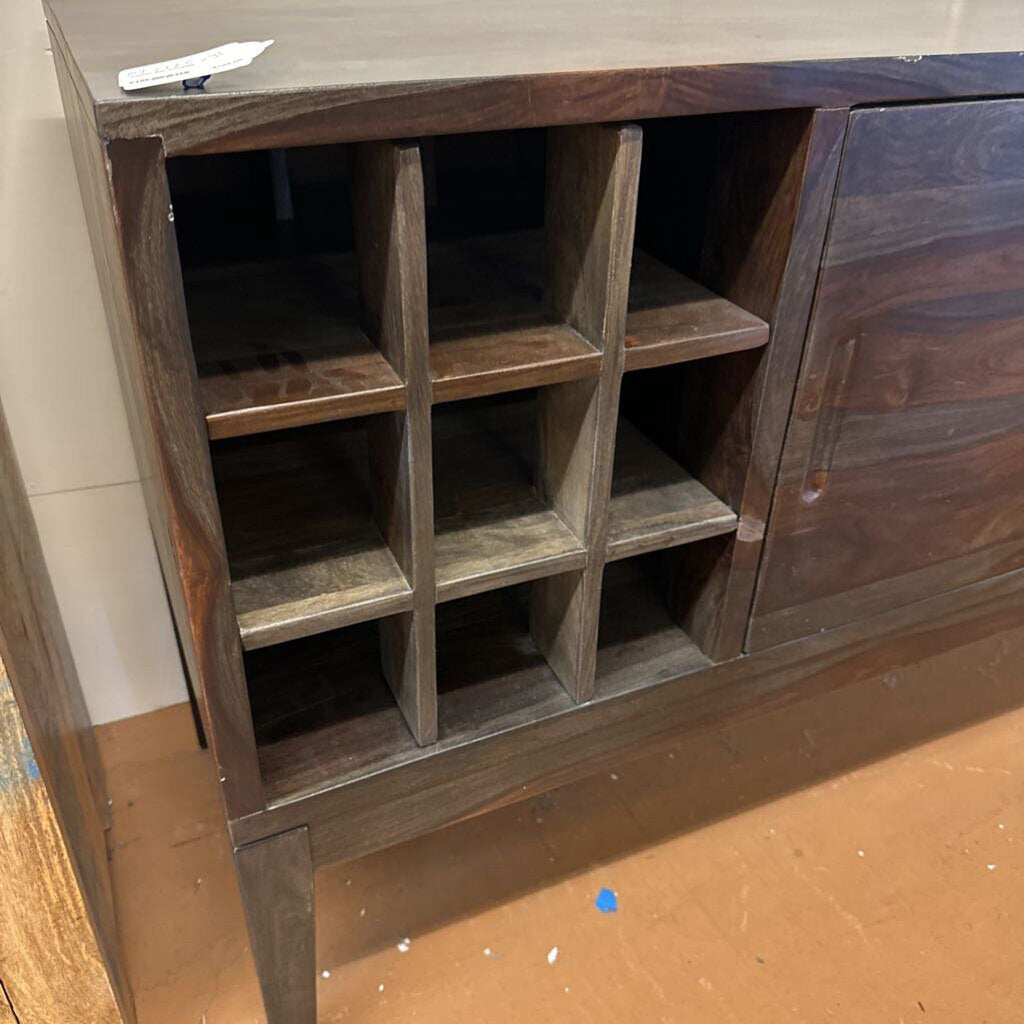 Wooden cabinet with open shelves on a wooden floor.
