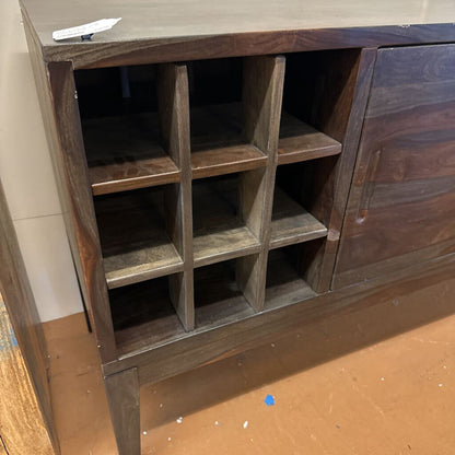 Wooden cabinet with open shelves on a wooden floor.