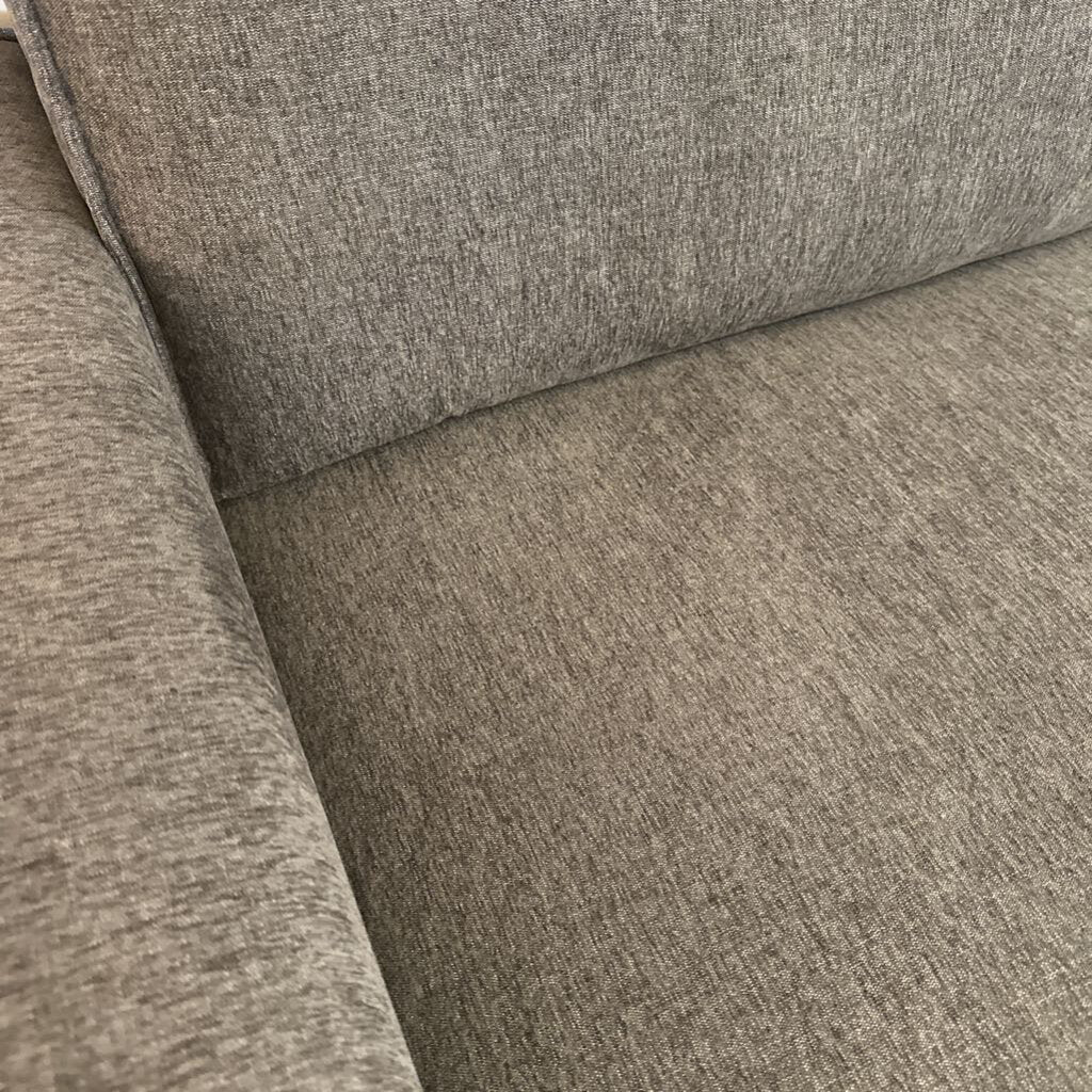 Close-up of a gray fabric surface with a textured pattern