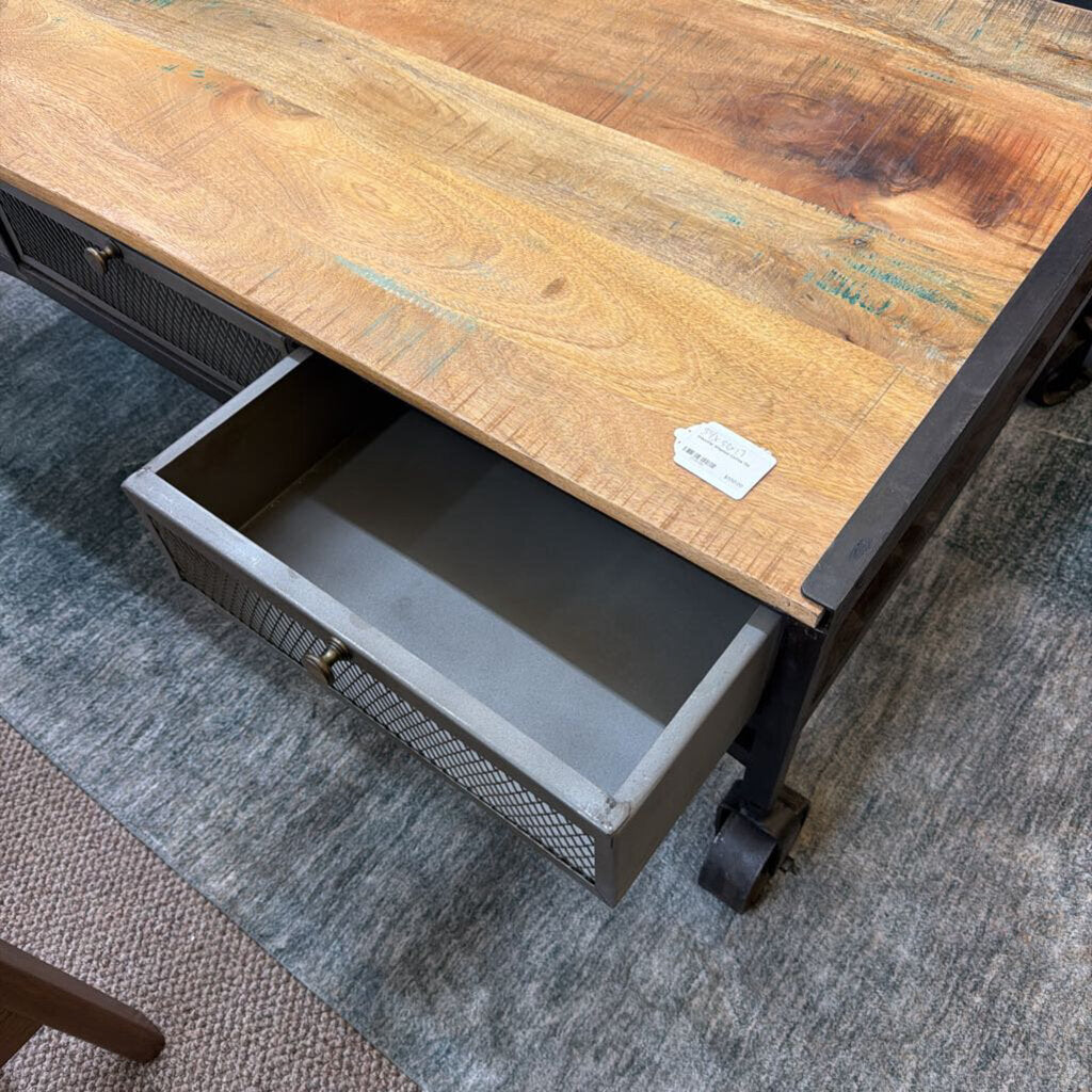 Wooden desk with a metal drawer on a gray carpet