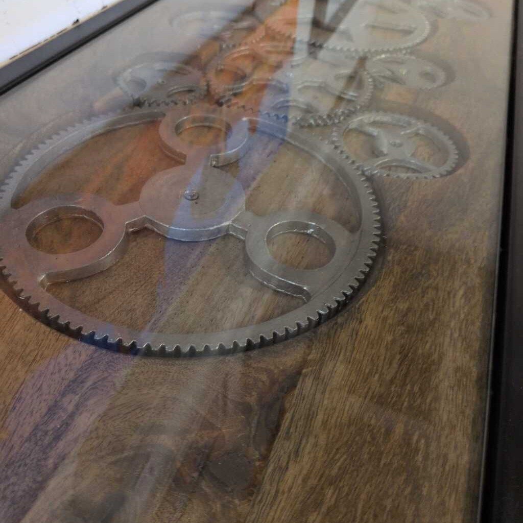 Metal gears on a wooden surface