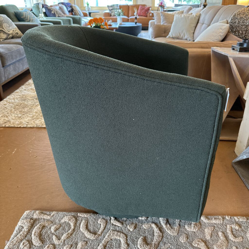 Green chair in a room with furniture and decor