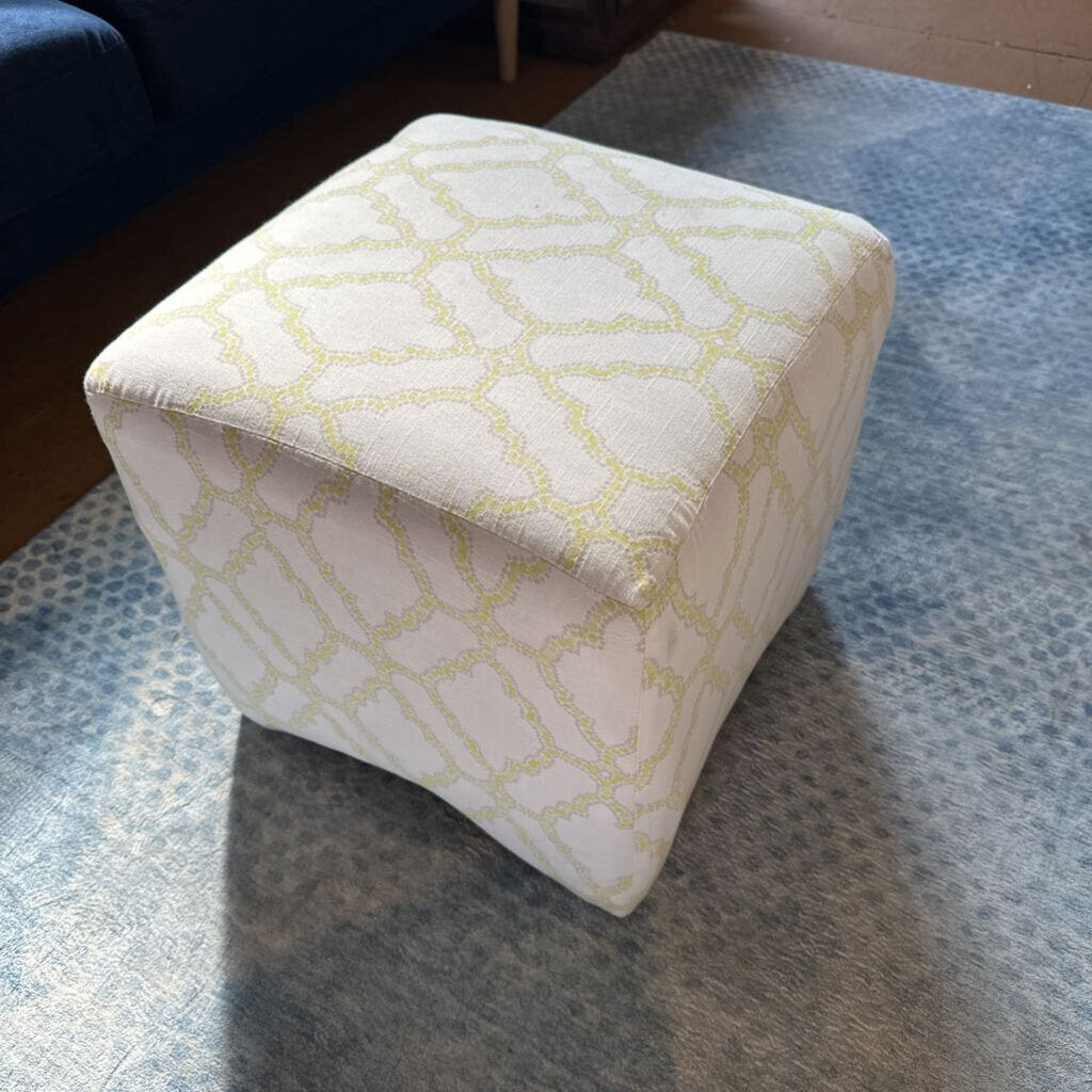 Patterned ottoman on a textured surface