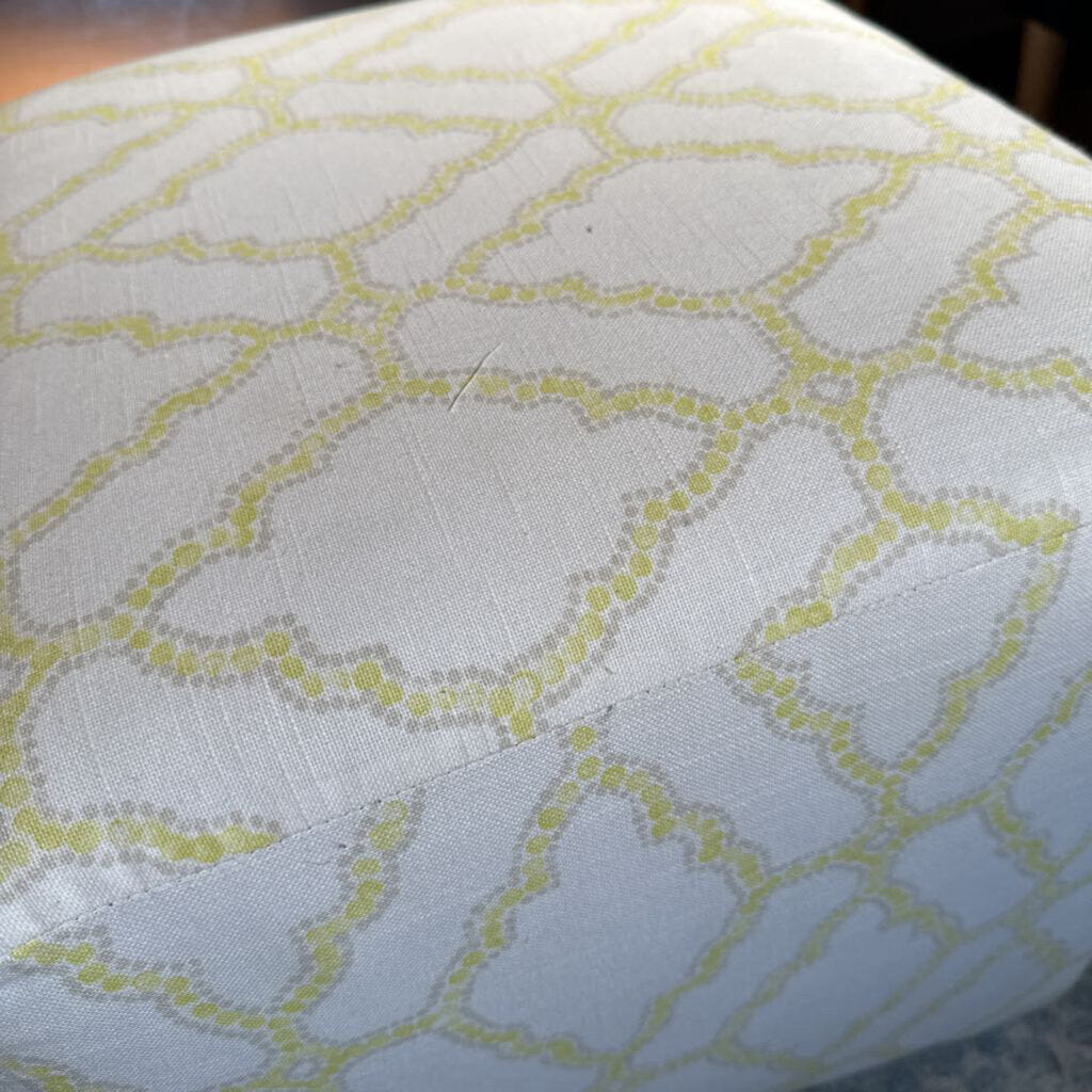 Close-up of a fabric with a geometric pattern on a light blue background