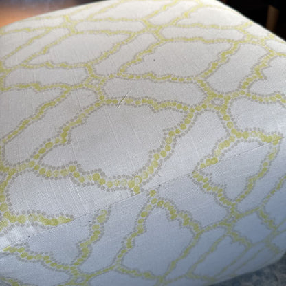 Close-up of a fabric with a geometric pattern on a light blue background