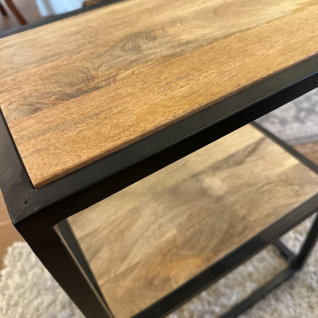 Wooden surface with metal frame on a textured background
