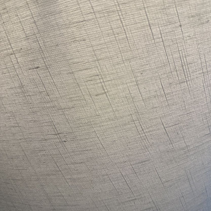 Close-up of gray textured fabric with a subtle pattern