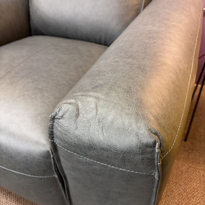 Gray sofa with a visible tear in the fabric