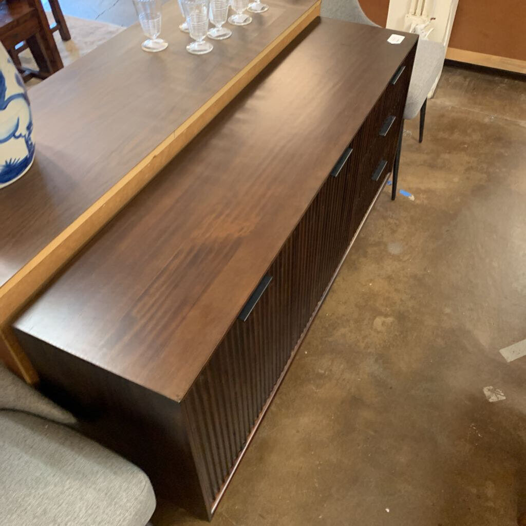 Wooden sideboard with a polished finish in an indoor setting
