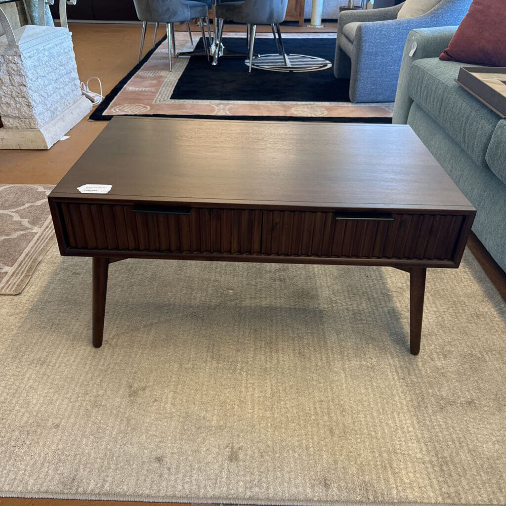 Wooden coffee table in a room with furniture and decor