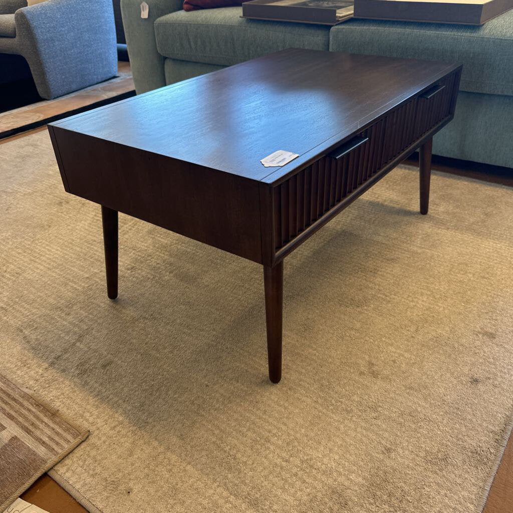 Dark wood coffee table in a living room setting