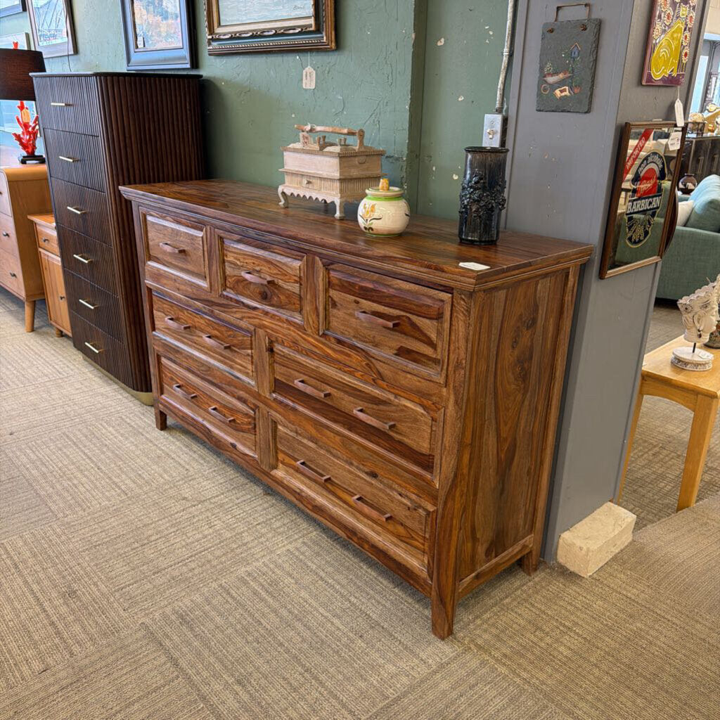 Wooden dresser in a room with furniture and decor