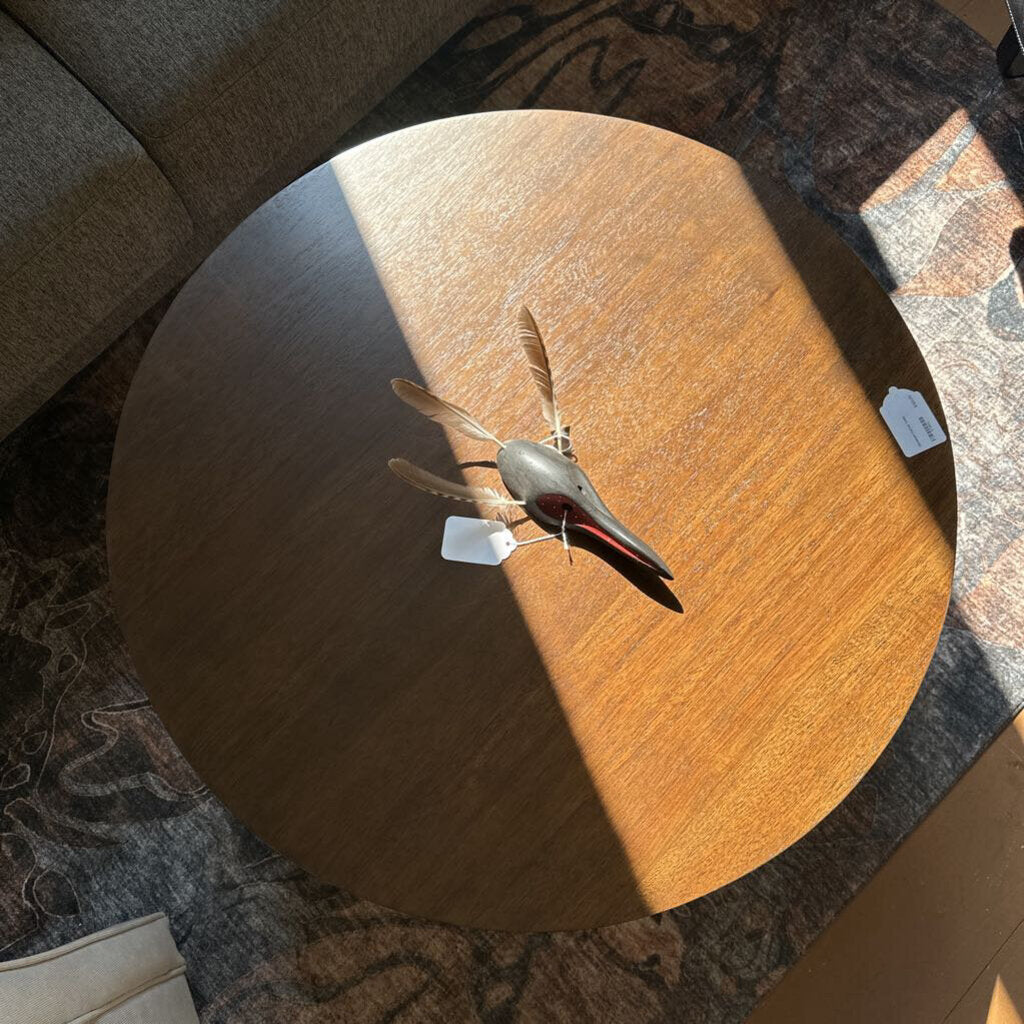 Wooden table with a small model airplane on top