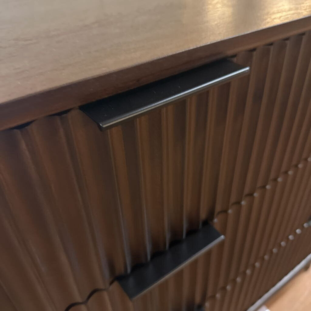 Wooden drawer with ribbed texture and black handle