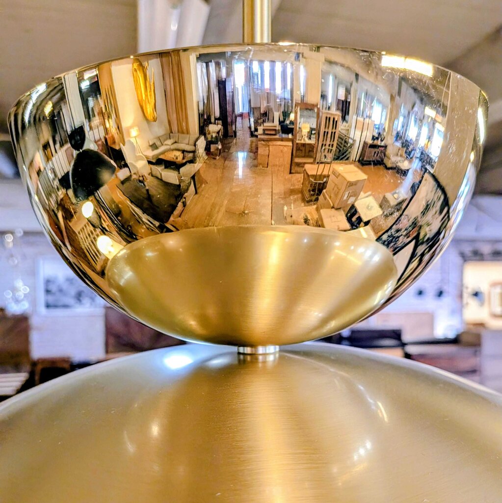 Gold bowl with reflective surface showing indoor setting