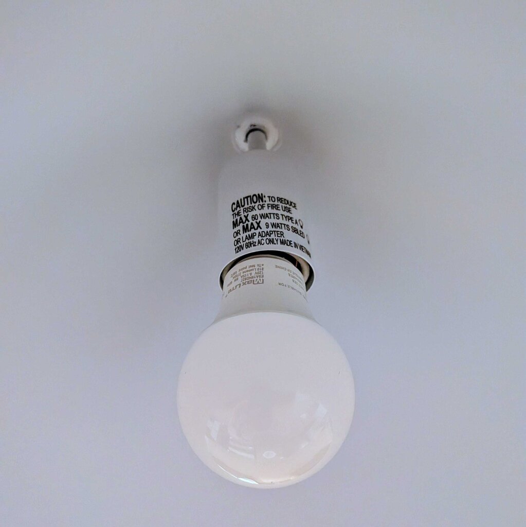 White light bulb with text on a white background