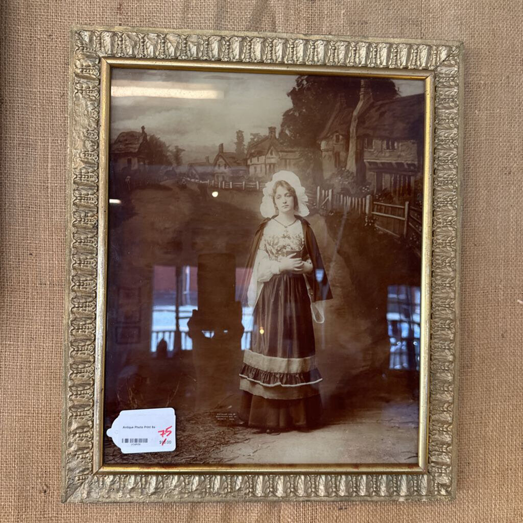 Vintage photograph of a woman in a frame on a textured brown background