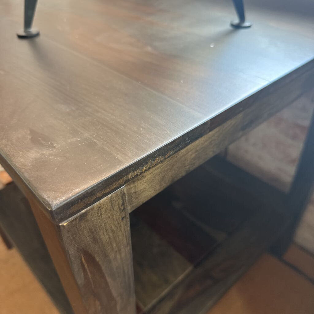 Wooden table with a rustic finish on a blurred background