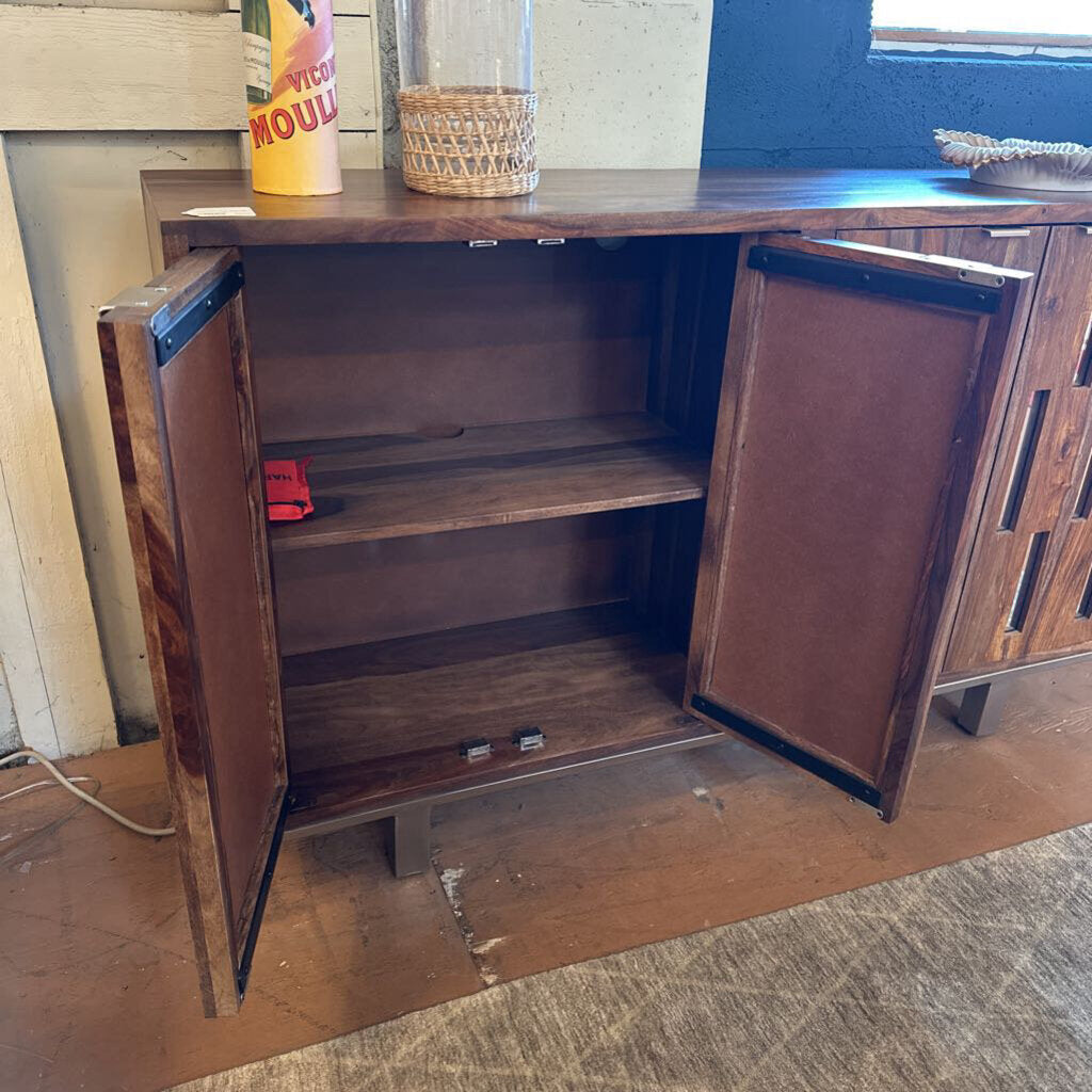Wooden cabinet with open doors on a wooden floor.
