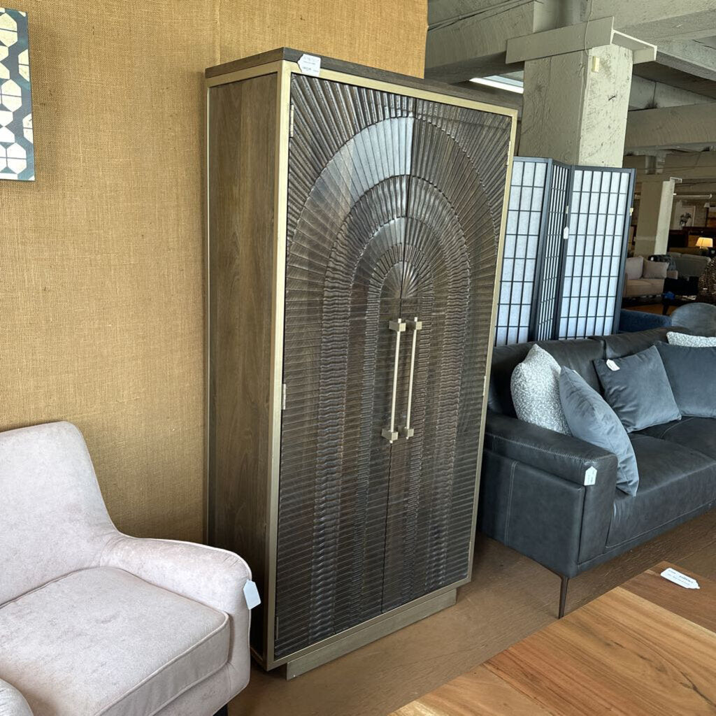 Decorative cabinet with intricate design in a living room setting