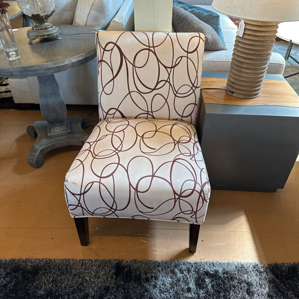Chair with brown pattern on a wooden floor