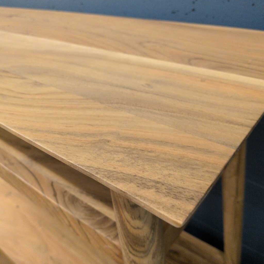 Wooden desk with a blue wall in the background