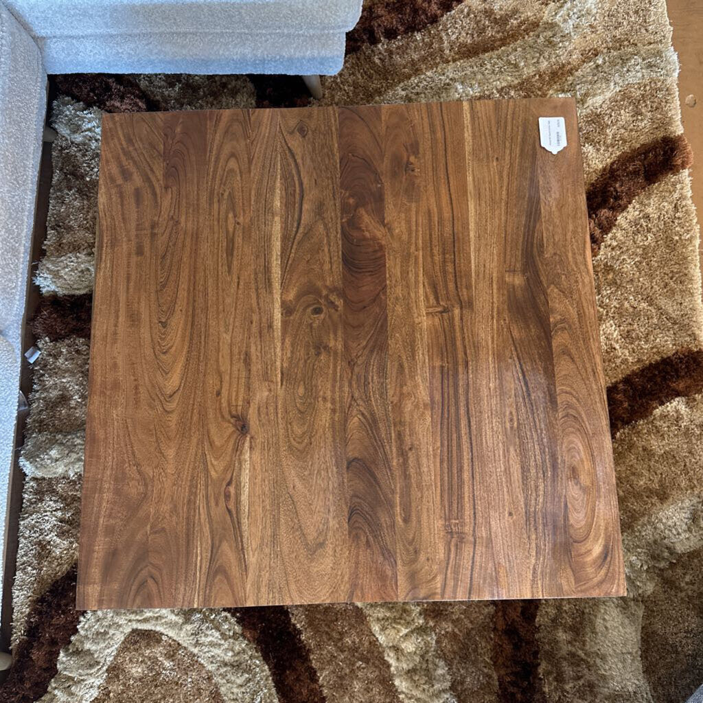 Wooden flooring sample on a carpeted floor