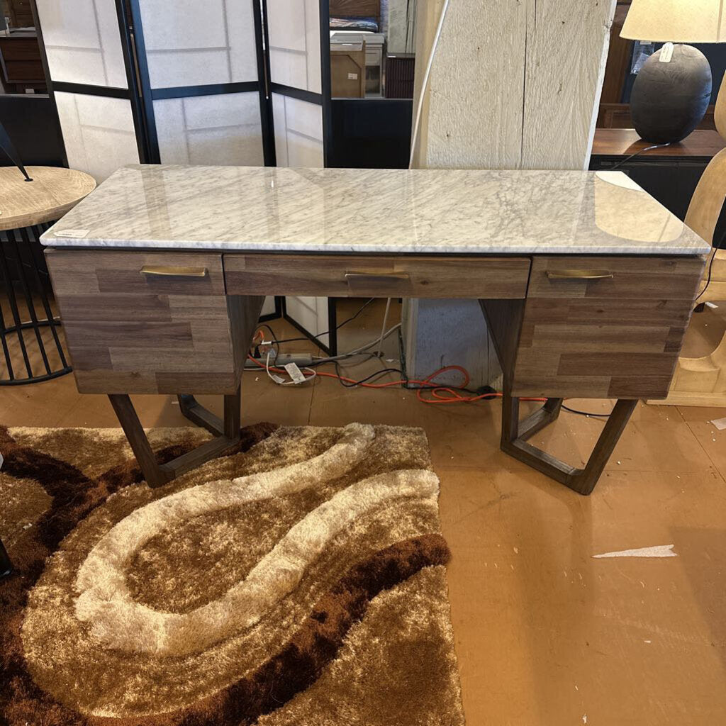 Wooden desk with marble-like top in a room setting