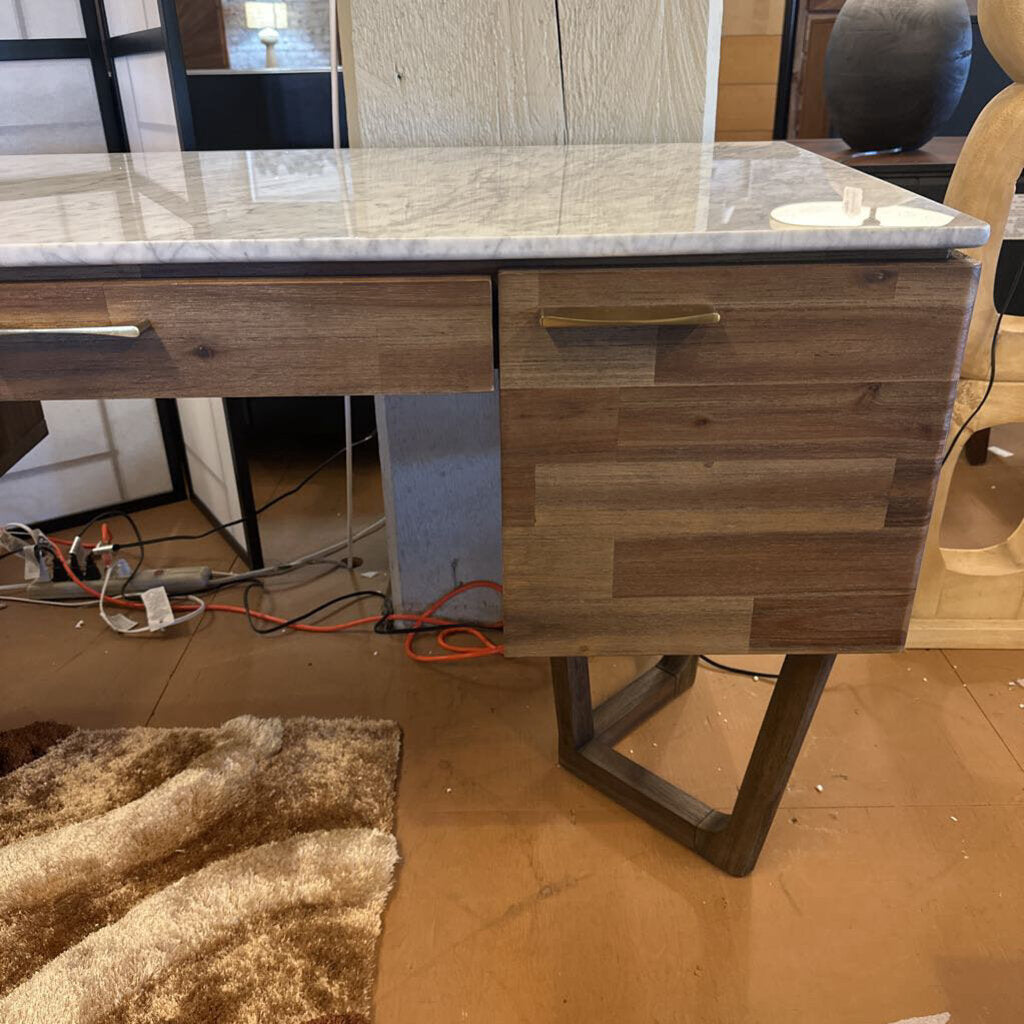 Wooden desk with marble top in a room setting