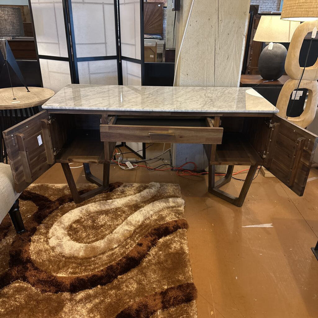 Dining table with marble-like surface in a showroom setting