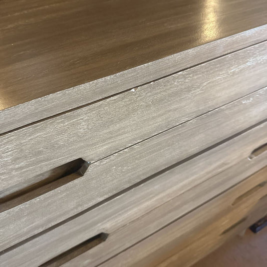 Close-up of a wooden surface with slats and a metallic background