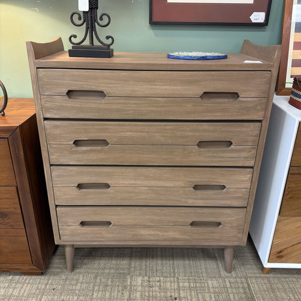 Wooden dresser with multiple drawers in a room setting
