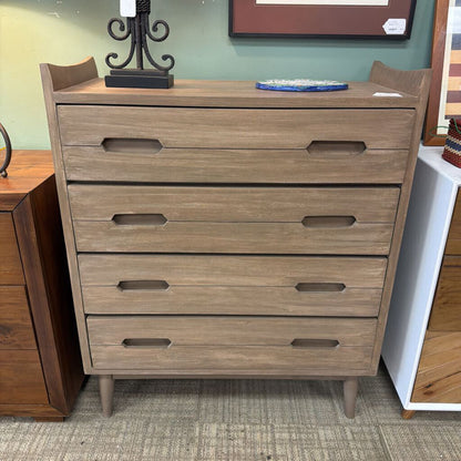 Wooden dresser with multiple drawers in a room setting