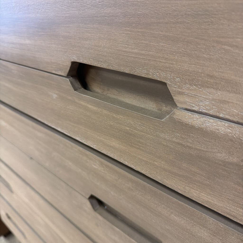 Close-up of a wooden drawer with a handle