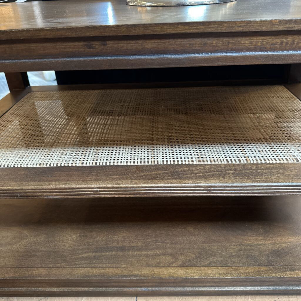 Wooden shelf with woven mat on a wooden surface